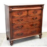 A Victorian mahogany chest of two short over three long drawers, with cushioned drawer,