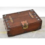 A Korean elm brass bound coin chest with ornate fish padlock and strapwork hinges,