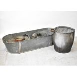 A collection of early 20th century kitchenalia to include a large oval tin bath with carrying