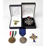 A group of German medals comprising a gilt and enamelled Cross of Honour of the German Mother,