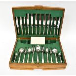 BOODLE & DUNTHORNE; an oak cased six-setting canteen of plated cutlery with reeded handles,