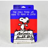 SNOOPY; a sticker bearing the signature of Charles Schulz both front and back,