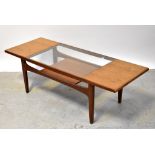 G-PLAN; a retro teak glass-topped two-tier coffee table, 43 x 137 x 50cm.
