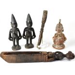 A small mixed lot of carved African figures, to include a pair of female figures,