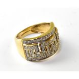 A 9ct yellow gold dress ring in the Art Deco style, with geometric pavé set diamonds, size K,