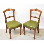 A set of six Victorian walnut bar back dining chairs with carved detail to the top and centre rails,