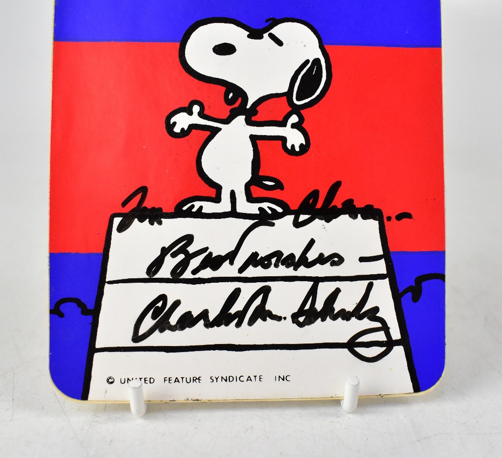 SNOOPY; a sticker bearing the signature of Charles Schulz both front and back, - Image 2 of 3