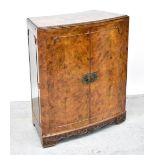 GEORGE STRACHAN & SON LTD; a mid-20th century burr walnut veneered bow-fronted drinks cabinet/bar,