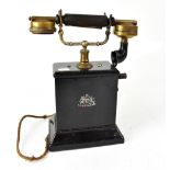 An early 20th century wind-up pillar telephone.