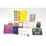 A quantity of British coins to include pennies, sixpences, three pence pieces, fifty pence pieces,