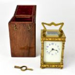 A late 19th century French gilt brass carriage clock, marked for R & Co of Paris, with winding key,