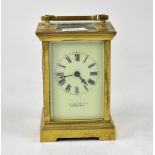 A brass cased carriage clock, the ivorine dial set with Roman numerals, maker's mark rubbed,