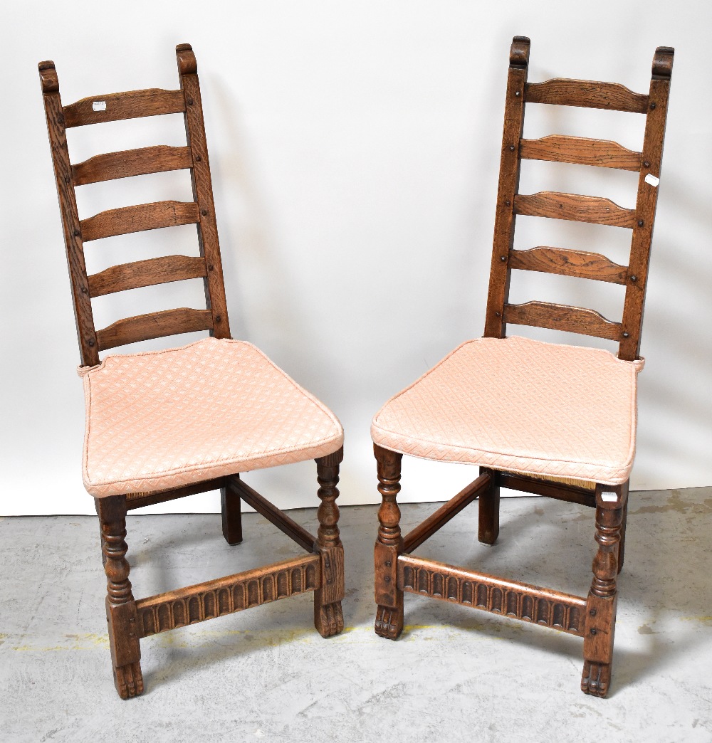 MONASTIC WOODCRAFT FURNITURE LTD; a set of six ladder back rush-seated chairs,