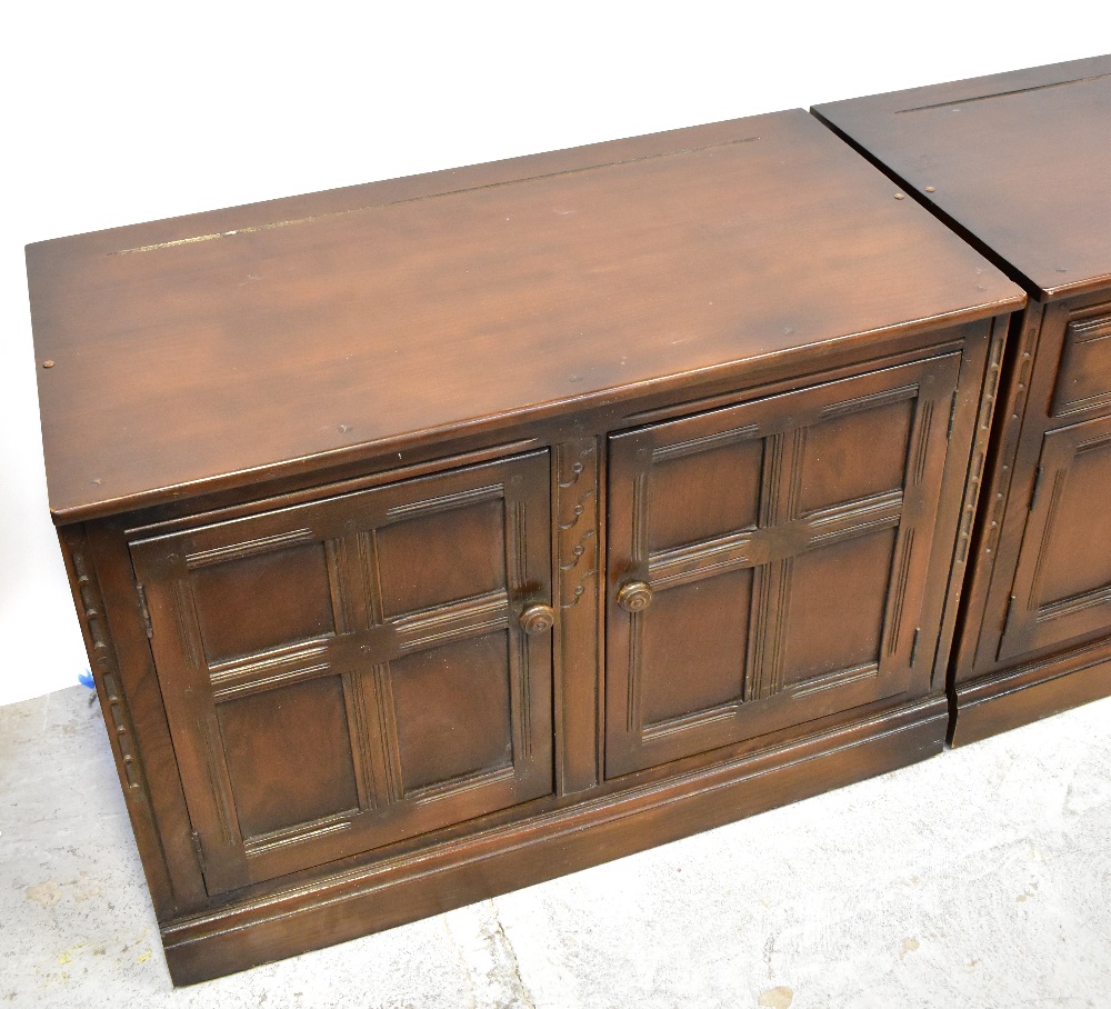 ERCOL; two dark dresser bases, one with a pair of fielded and panelled cupboard doors, - Image 3 of 6