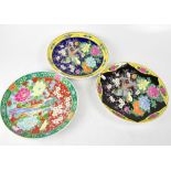 Three 20th century Japanese decorative wall plates, one in Famille Noire palette, with peony,