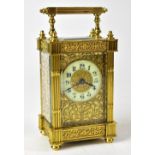 A French brass cased carriage clock, the ivorine dial set with Arabic numerals,