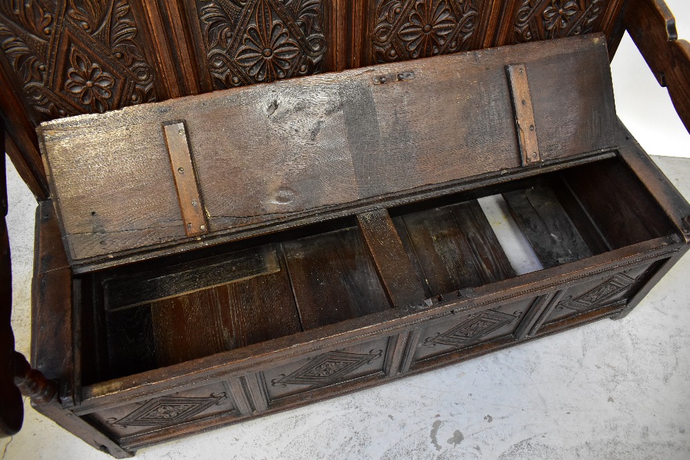 A Georgian carved oak settle, - Image 4 of 5