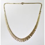 A 9ct yellow gold ladies' bark-effect collar necklace, approx 5.7g.