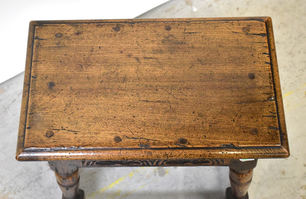 An oak joint stool with carved foliate panels to the apron, - Image 2 of 3