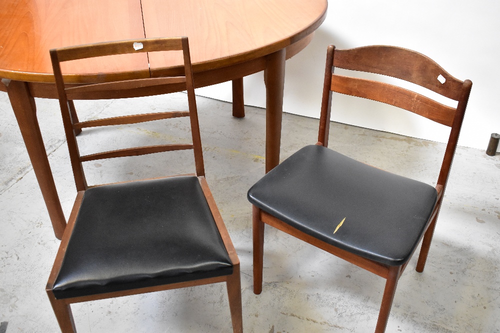 A 20th century teak oval extending dining table on tapering legs, approx 74 x 140 x 100cm, - Image 2 of 5