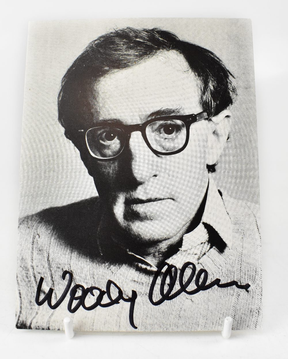 WOODY ALLEN; a black and white photographic postcard bearing the star's signature. - Image 2 of 2