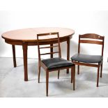 A 20th century teak oval extending dining table on tapering legs, approx 74 x 140 x 100cm,