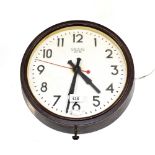 A large 20th century 'Smiths Cetric' station-style wall clock within a Bakelite case,