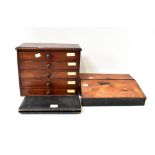 An early 20th century marquetry writing slope with pull-out pen tray and velvet slope,