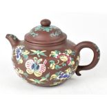 A late 19th/early 20th century Yixing enamelled teapot,