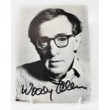 WOODY ALLEN; a black and white photographic postcard bearing the star's signature.