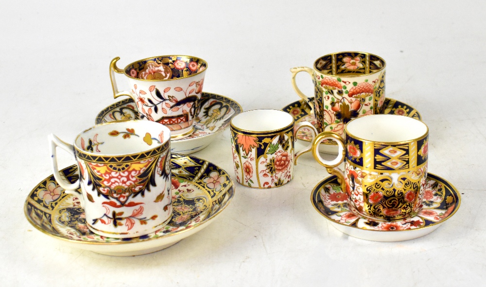 A group of late 18th/early 19th century coffee cans and saucers,