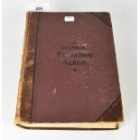 A partially filled 'The Standard Postage Album' published by Whitfield, King & Co,