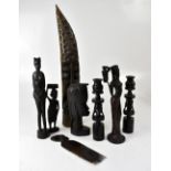 Various carved hardwood African tourist items, to include a pair of candlesticks,