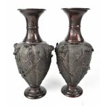 A pair of Japanese bronze baluster vases with flared rim,