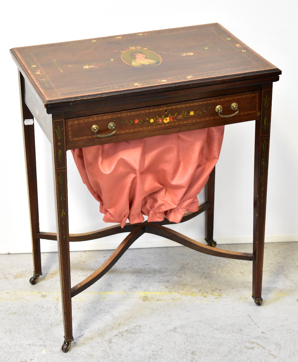 An Edwardian mahogany inlaid and satinwood crossbanded combination games/sewing table,