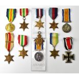 A group of WWI and WWII medals comprising a Victory Medal for Pte. H G Wells K.R. Rif.C.