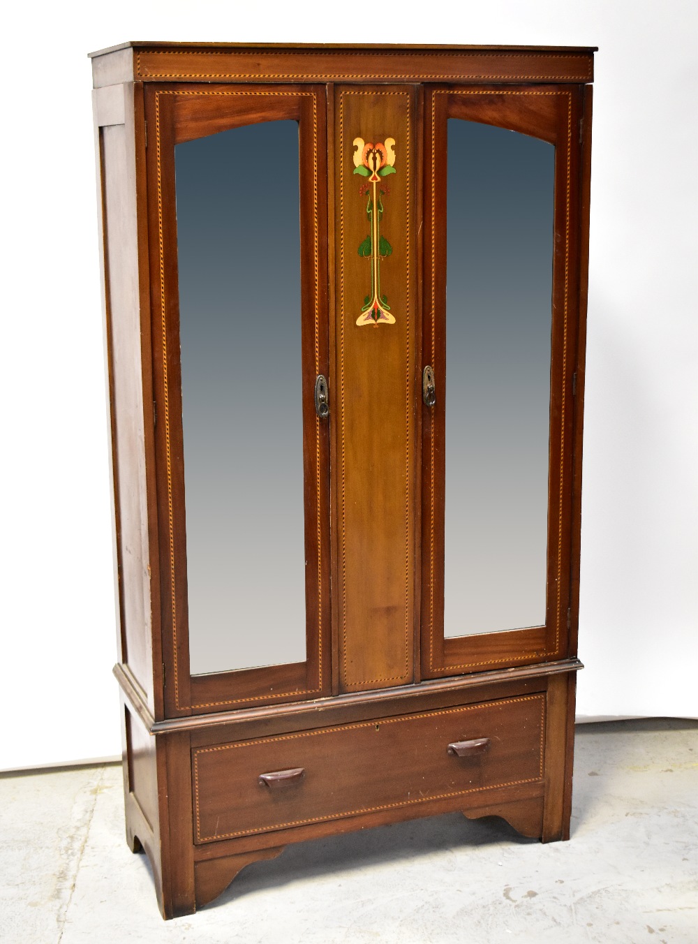 An Edwardian Art Nouveau mahogany twin mirror door wardrobe,