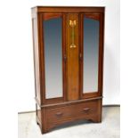 An Edwardian Art Nouveau mahogany twin mirror door wardrobe,