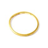 A 22ct yellow gold thin wedding band, size K, approx 1g.