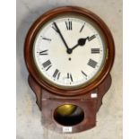 An early 20th century mahogany cased station-style wall clock,