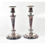 A pair of plated Barker & Ellis Classical tapering column candlesticks to circular stepped bases,