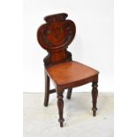 A William IV mahogany shield back hall chair,