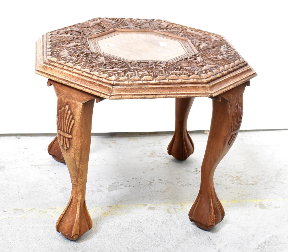 An Indian carved hardwood octagonal-topped occasional table,