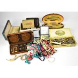 A quantity of costume jewellery to include beaded necklaces, various earrings, brooches,