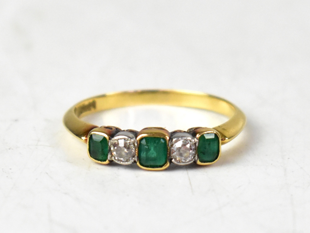 An 18ct yellow gold five-stone ring set with alternating emerald cut emeralds and rose cut diamonds,