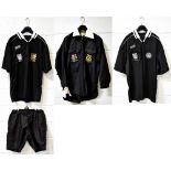 Two black football referee shirts, both with 'FA Referee' embroidered logo to chest pockets,