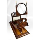 A Victorian figured walnut tabletop stereoscope with sliding fret cut main panel and hinged