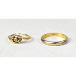 Two gold rings comprising a band ring,