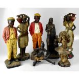 A group of painted plaster and resin figures.