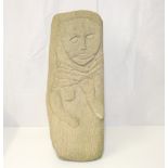 A contemporary carved Lake District stone sculpture of triangular form,